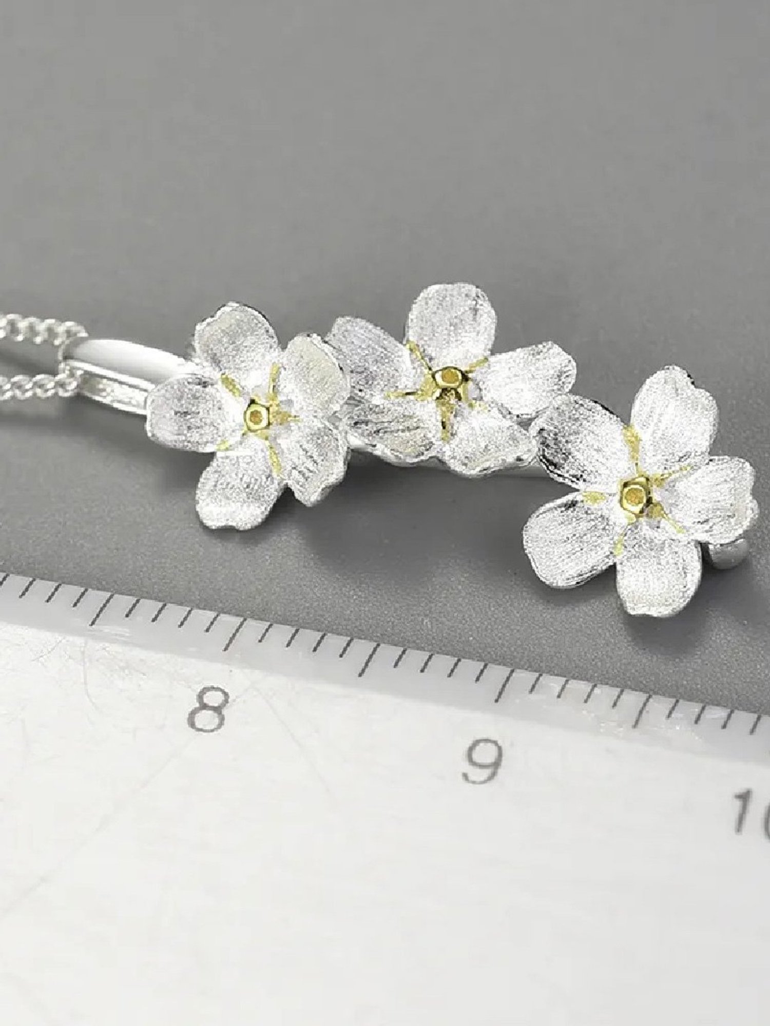 Rihi by P.C. Chandra Jewellers Silver Forget Me Not Flower Pendant (Without Chain)