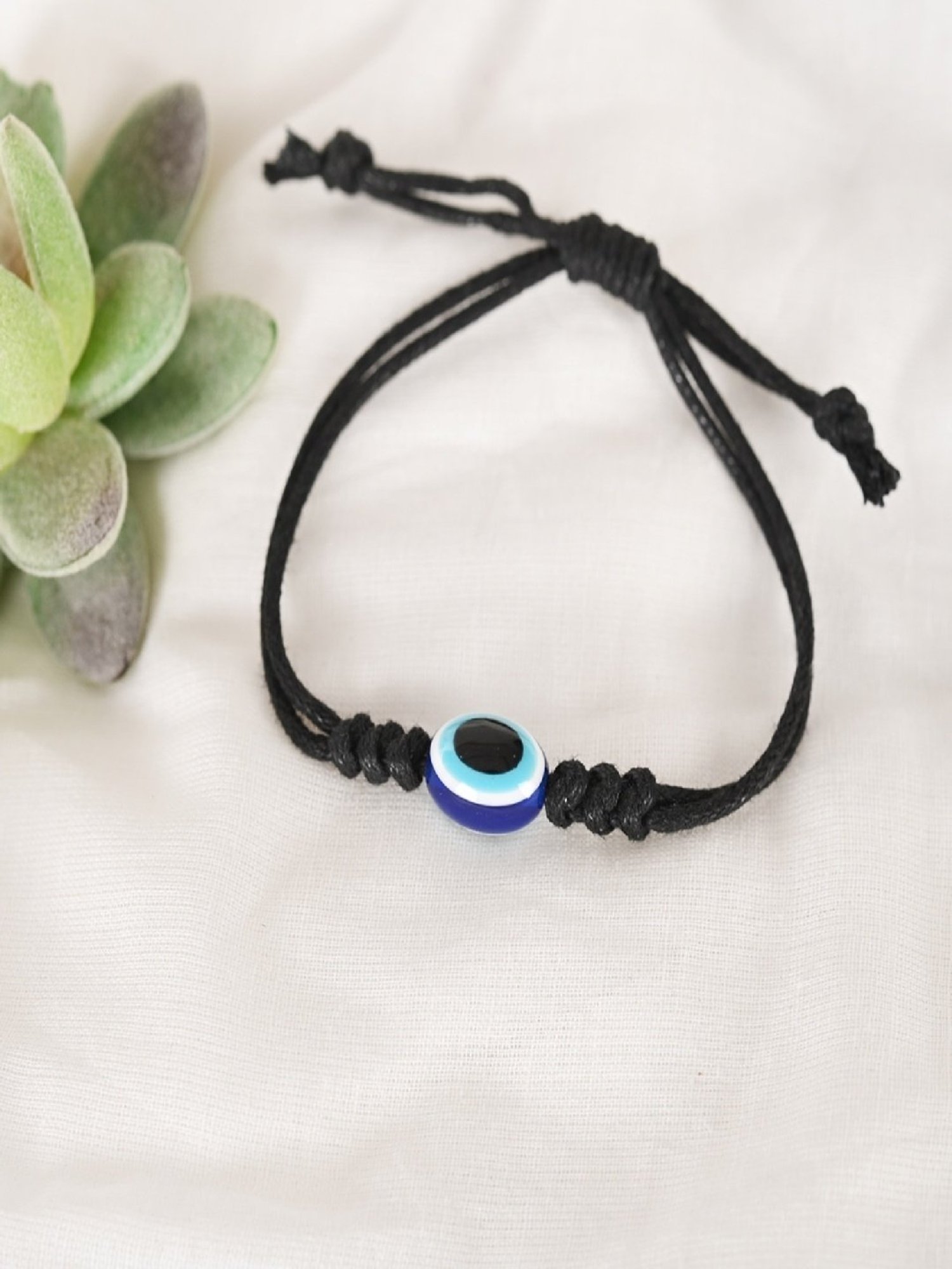 NVR Black Evil Eye Rakhi with Roli Chawal