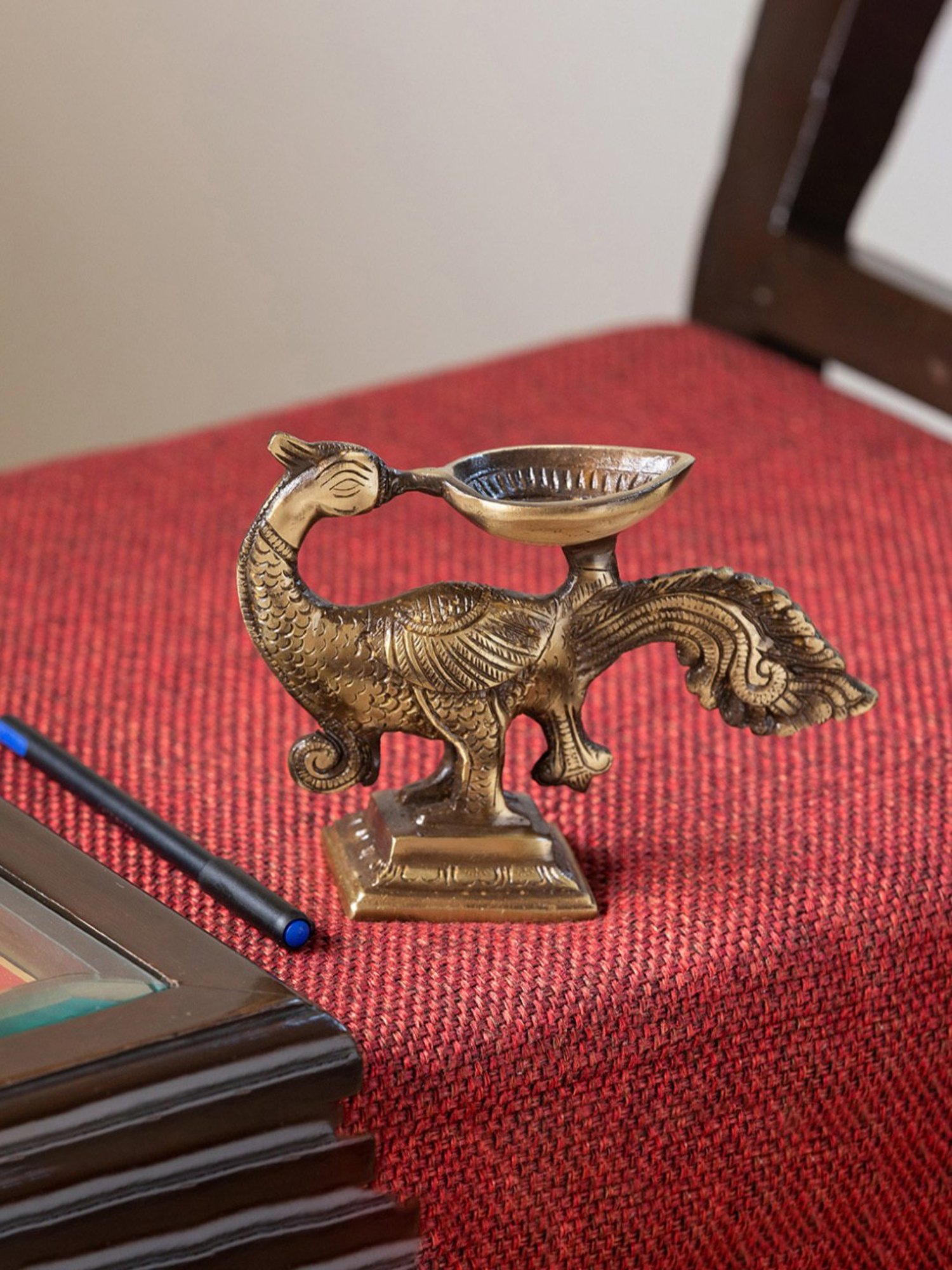 ExclusiveLane Gold Brass Glowing Peacock Hand-Etched Carved Diya