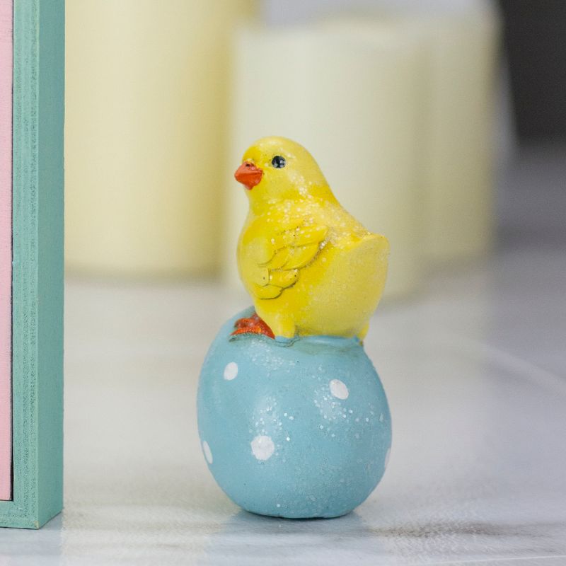 Darice 4" Yellow Chick Perched on a Blue Easter Egg Tabletop Decor
