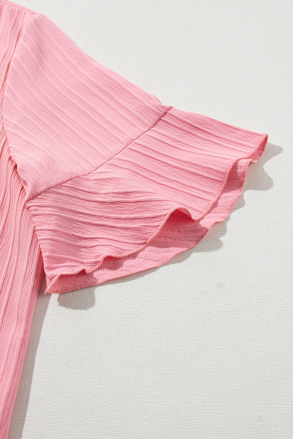 Peach Blossom Solid Color Textured V Neck Short Sleeve Plus Size Blouse