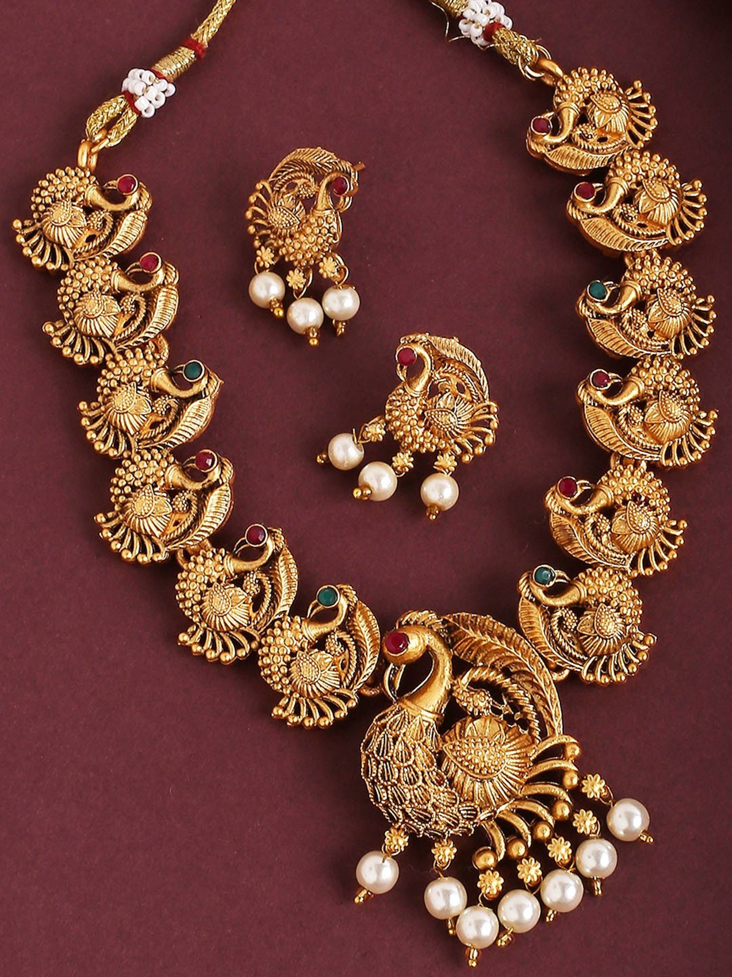 OOMPH Antique Gold Tone Red & Green Stone Peacock Design Necklace Set with Drop Earrings