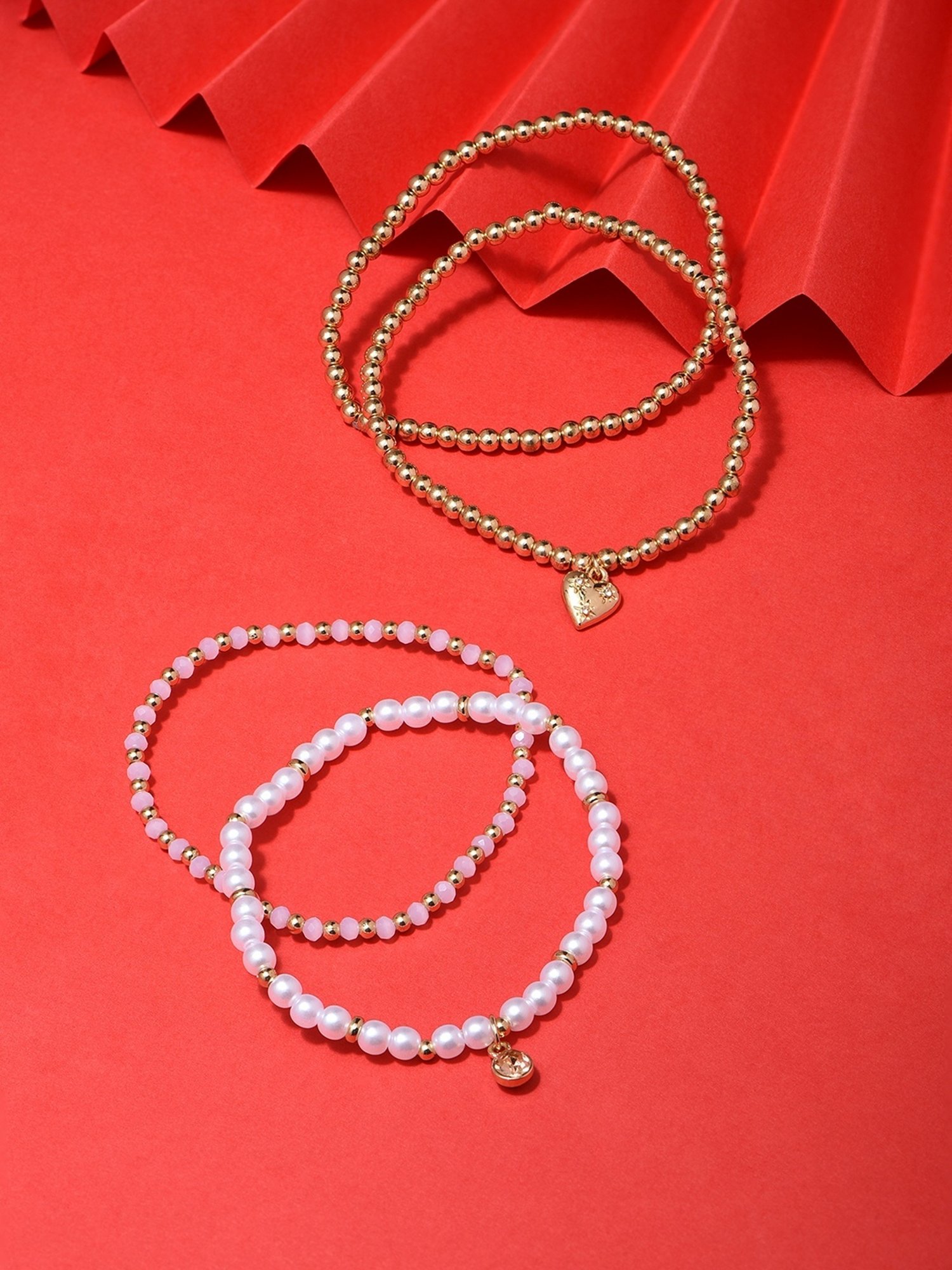 ToniQ Pearl Fusion Wear Alloy Multi Stretch Bracelet for Women - Set of 4