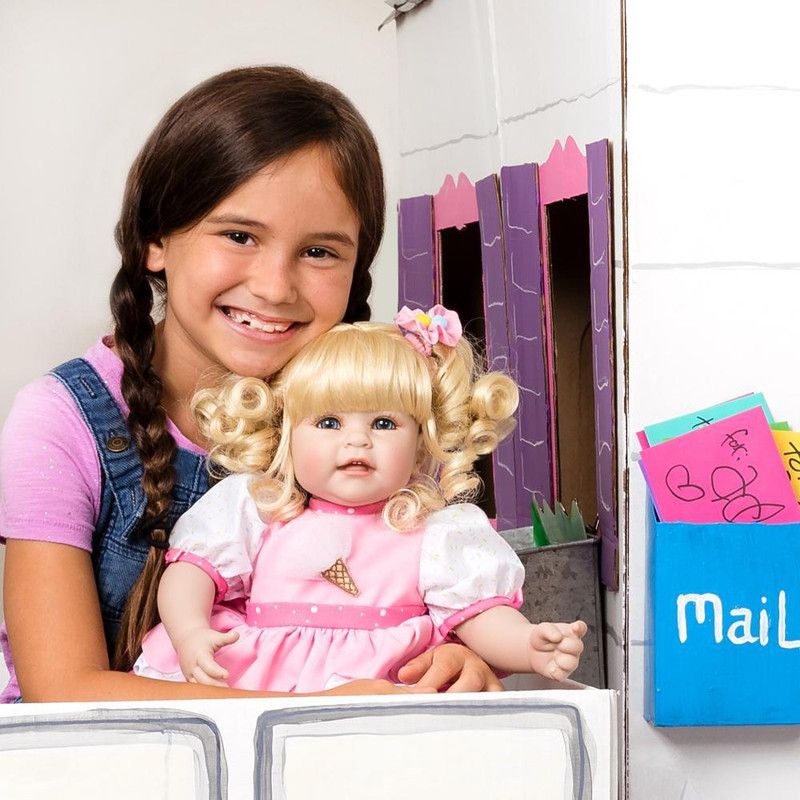 Adora Toddler Doll Ice Cream Party with layered petal party dress and pom pom hair accessories