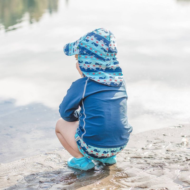 i play by green sprouts Baby Boys' Whale Stripe Reversible Flap Swim Hat - Navy/Aqua/Gray 0-6M