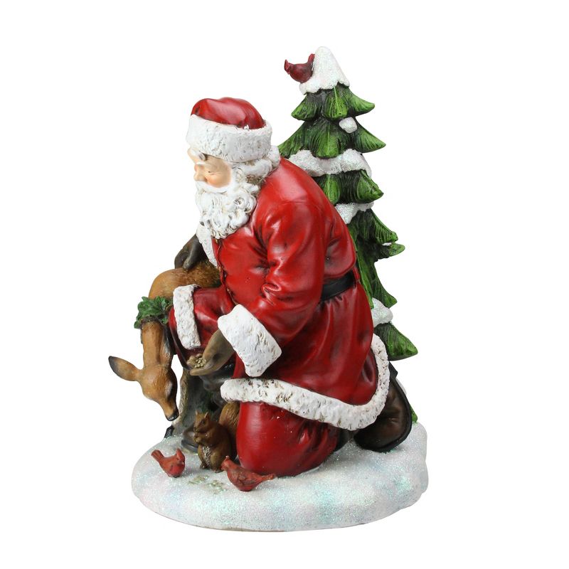 Napco 11.5" Red and White Santa Claus Feeding The Animals Christmas Table Figurine