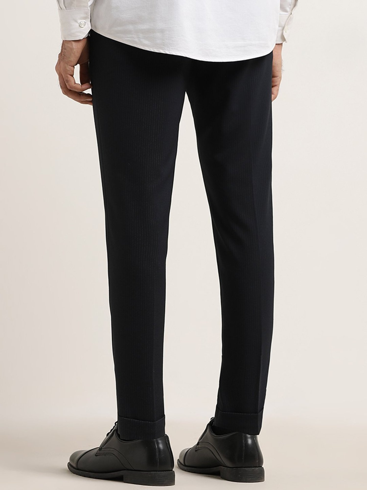 WES Formals by Westside Black Pinstripe-Detailed Carrot-Fit Trousers