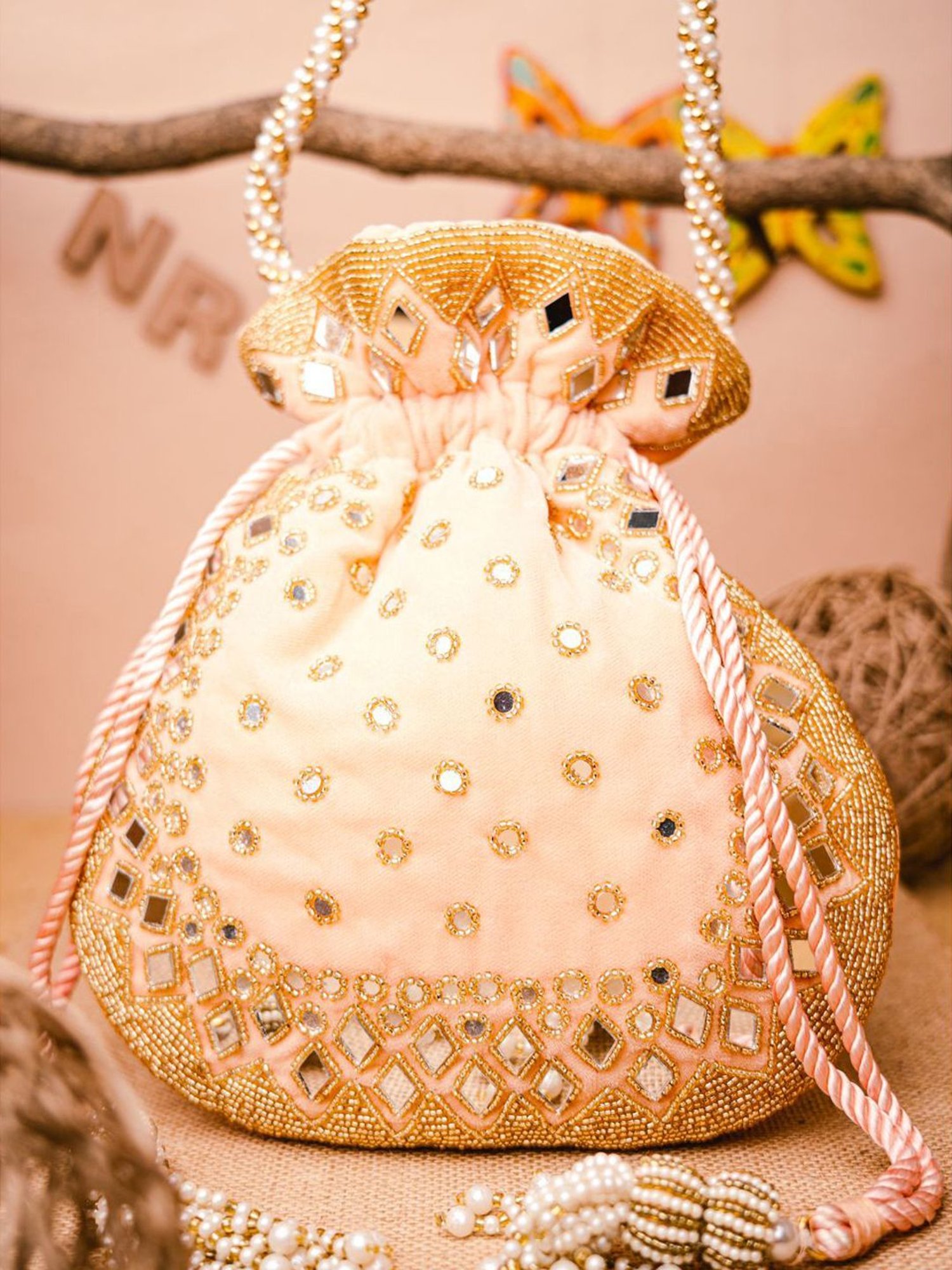 NR by Nidhi Rathi Peach Embellished Potli