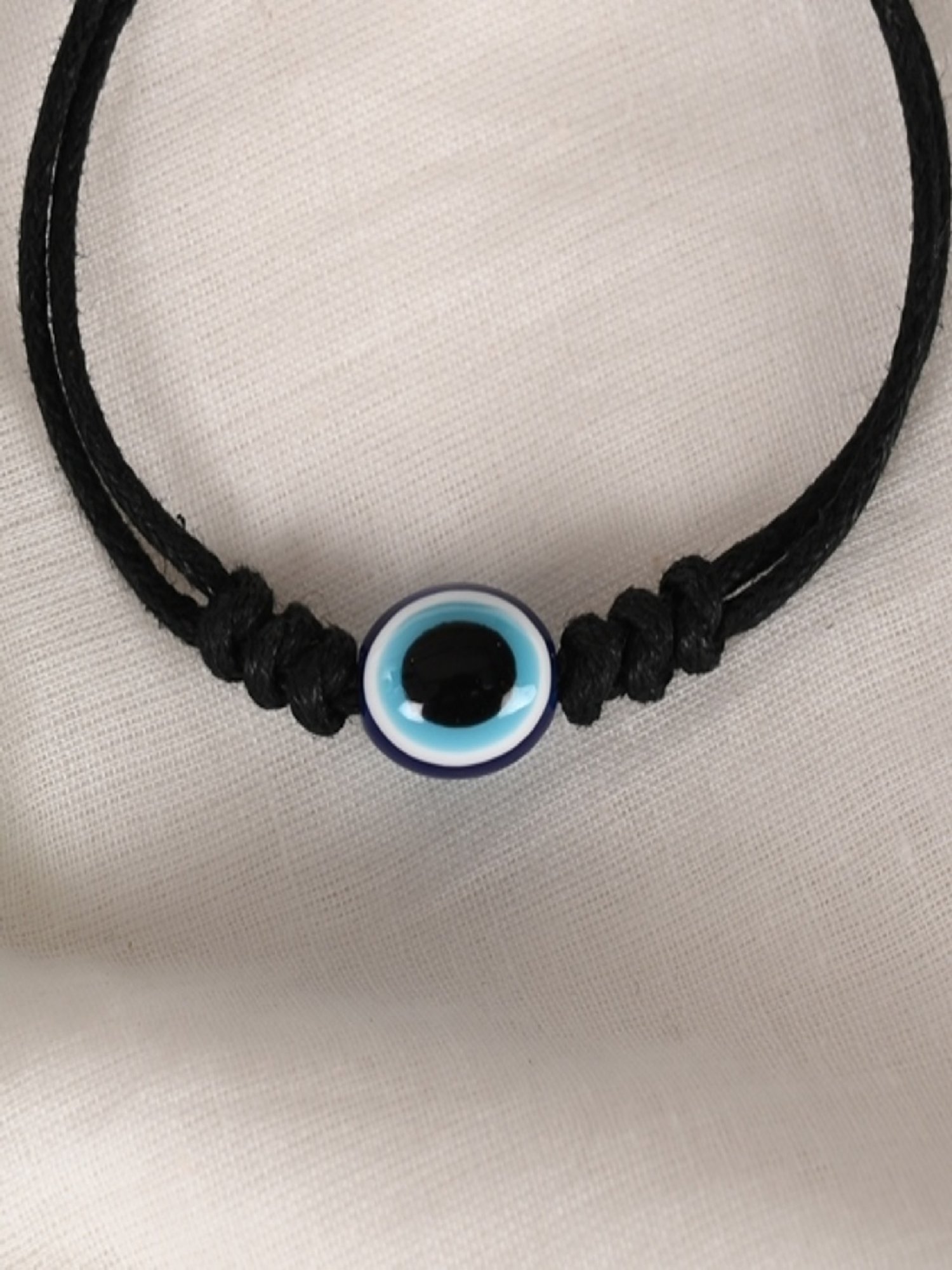 NVR Black Evil Eye Rakhi with Roli Chawal