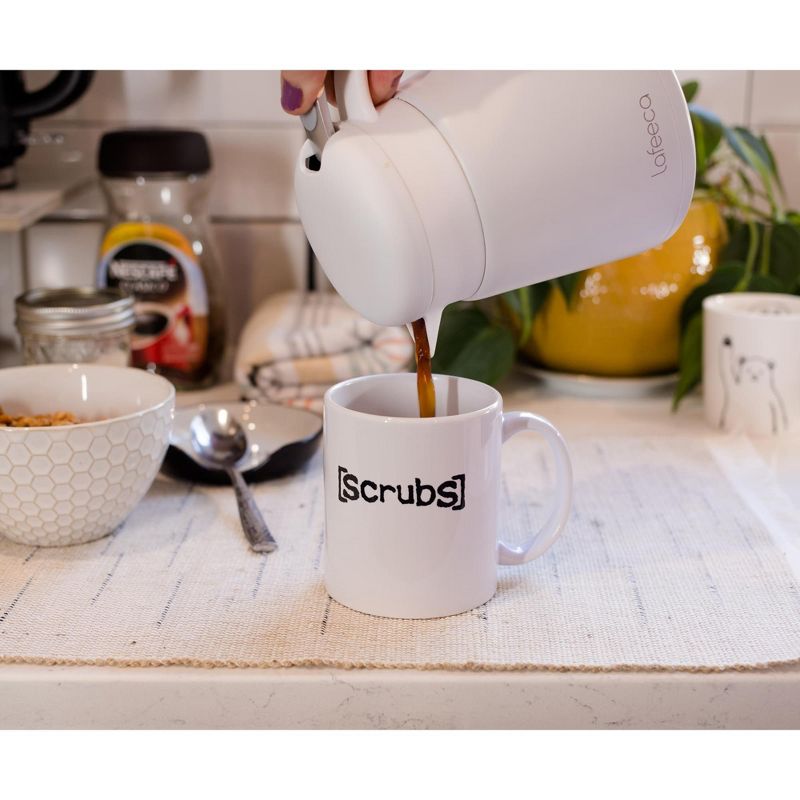 Surreal Entertainment Scrubs Sacred Hearts Hospital Logo Ceramic Mug | Holds 11 Ounces