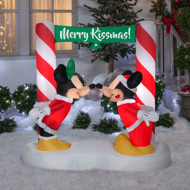 Gemmy Airblown Inflatable Mickey and Minnie Kissing Under Mistletoe Banner Scene Disney, 5.5 ft Tall