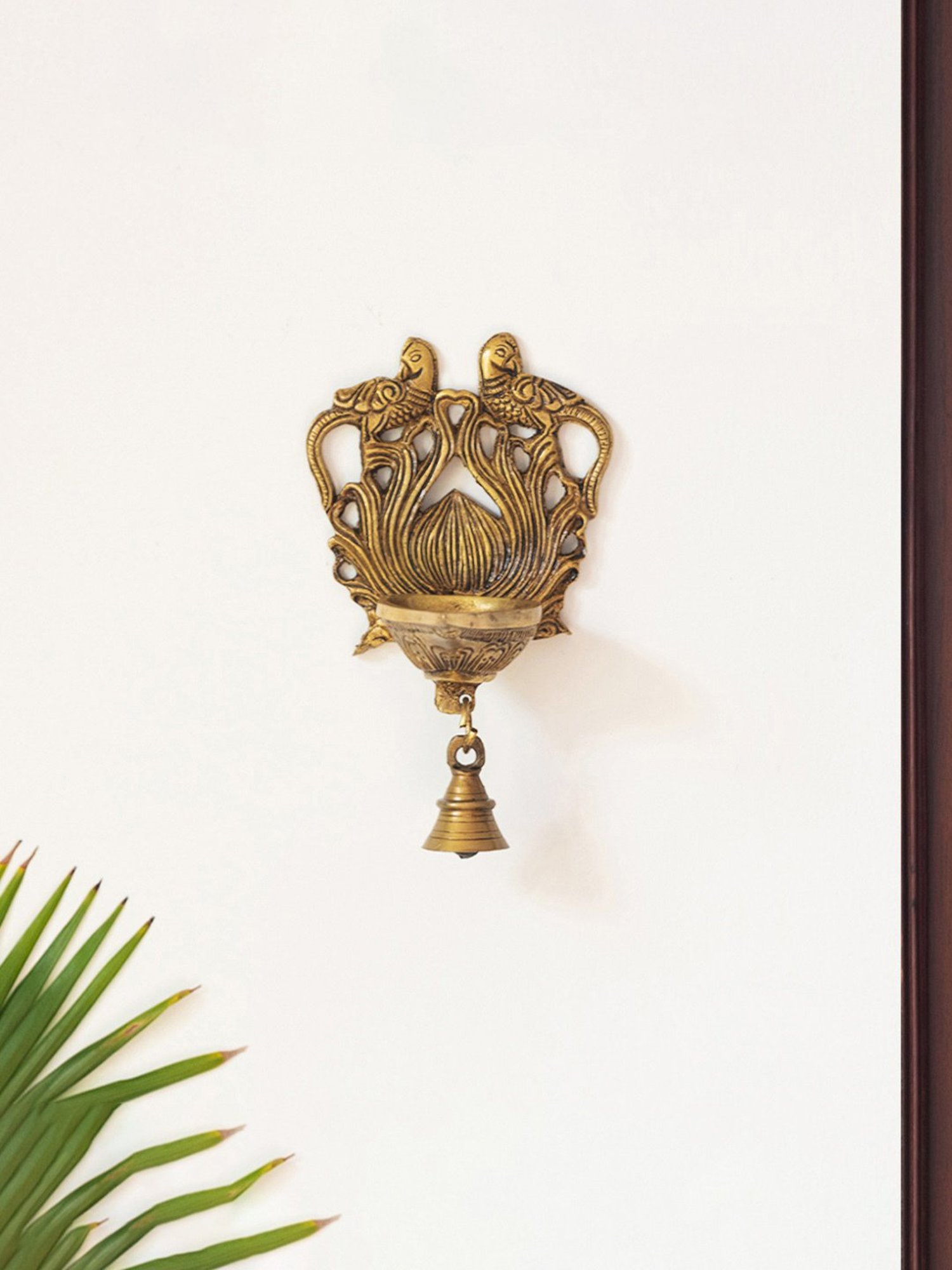 ExclusiveLane Gold Brass Carved Peacock Hand-Etched Decorative Wall Hanging Diya With Bells