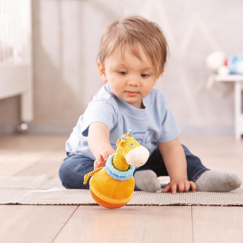 HABA Roly Poly Giraffe Soft Wobbling & Chiming Baby Toy with Teething Rings