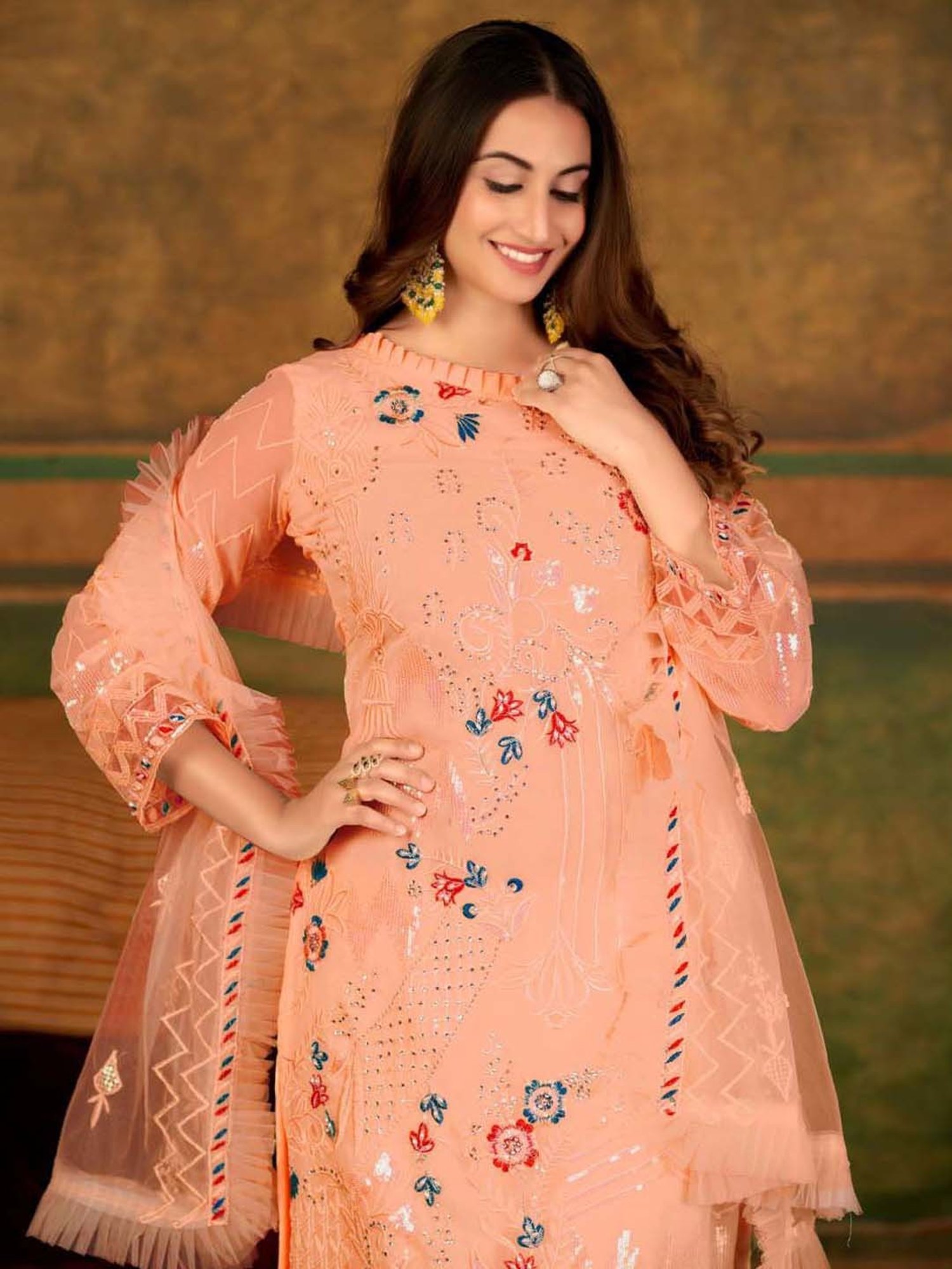 Warthy Ent Orange Embellished Semi Stitched Dress Material