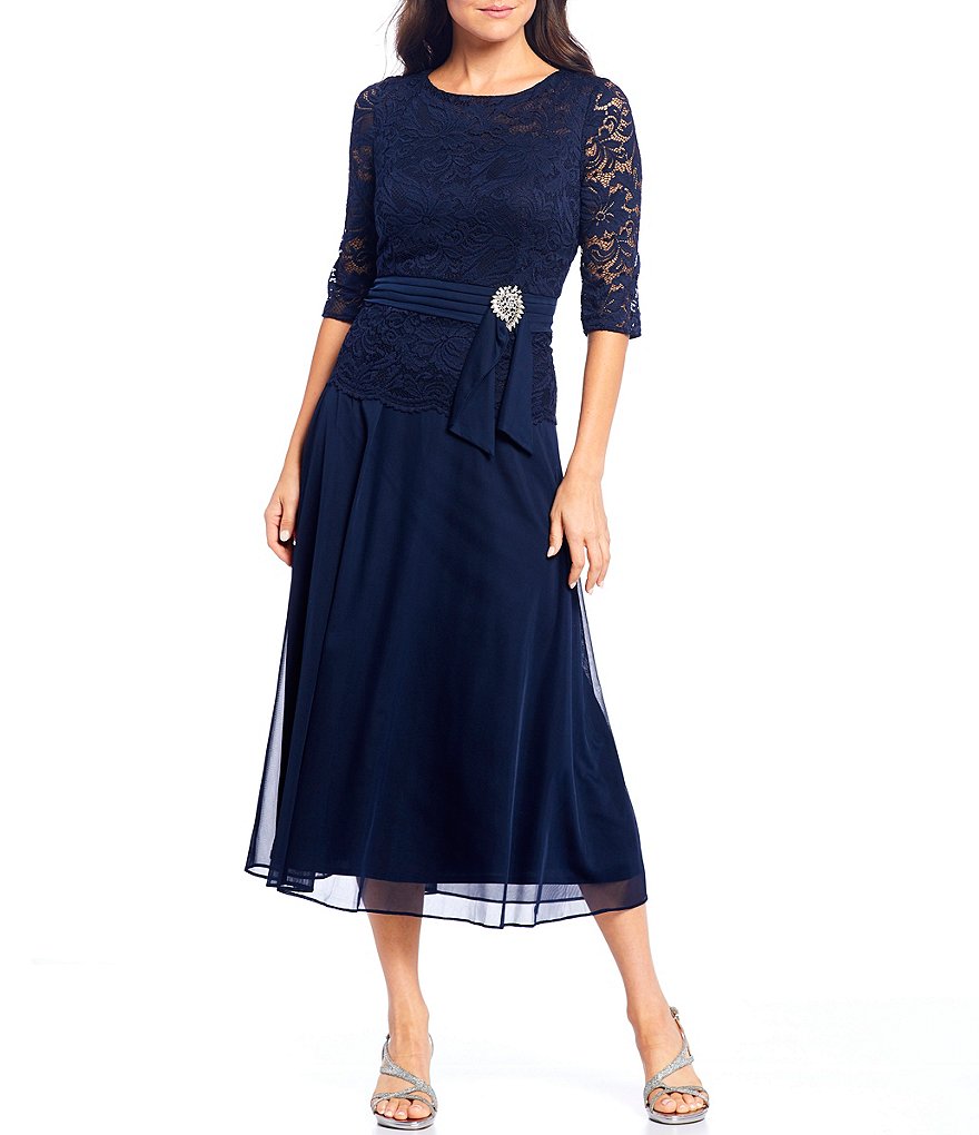Le Bos Round Neck 3/4 Sleeve Stretch Lace Bodice Ruched Waist With Broach Detail Tea Length Gown